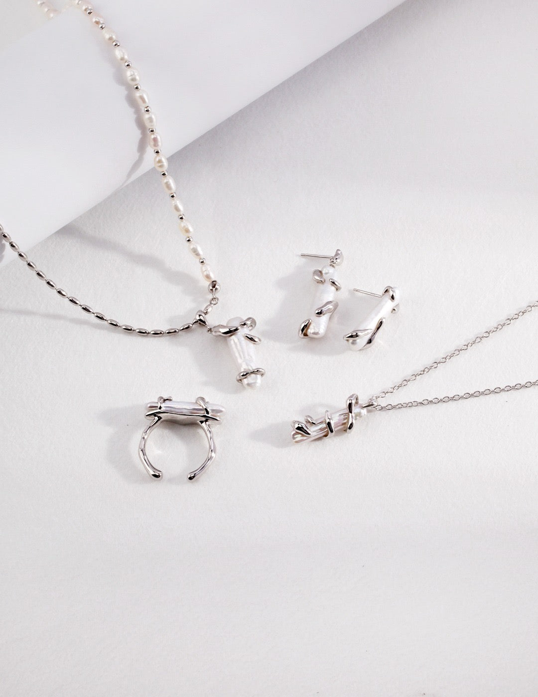 Fluid Baroque Pearl Stud Earrings in Gold and Sterling Silver | BARØ