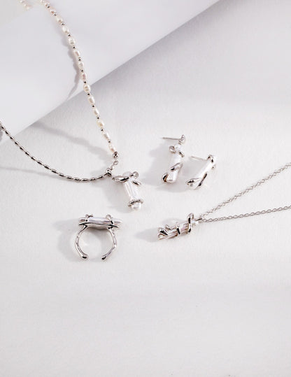 Fluid Baroque Pearl Stud Earrings in Gold and Sterling Silver | BARØ