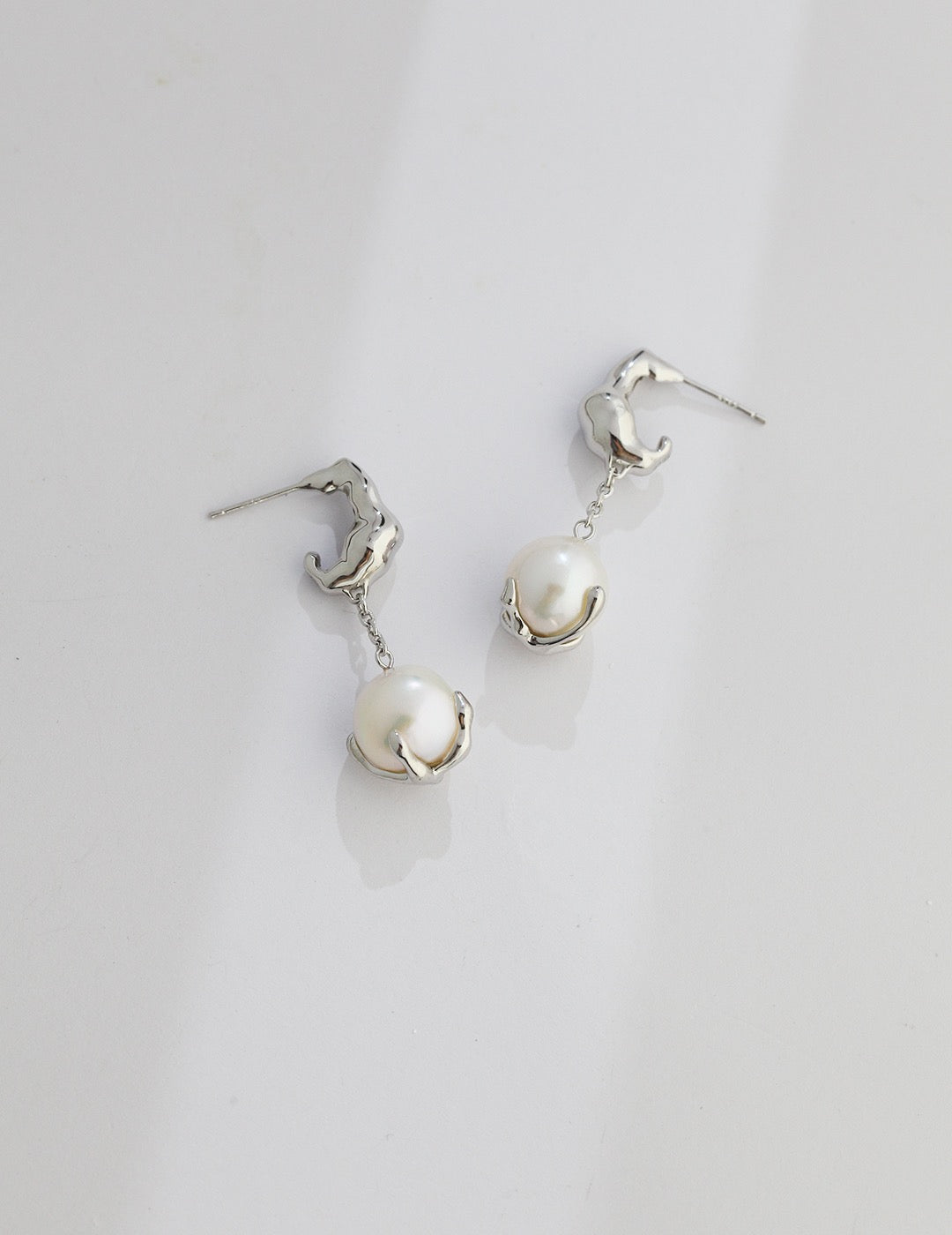 Fluid Sculptural Pearl Drop Earrings in Gold and Silver | BARØ