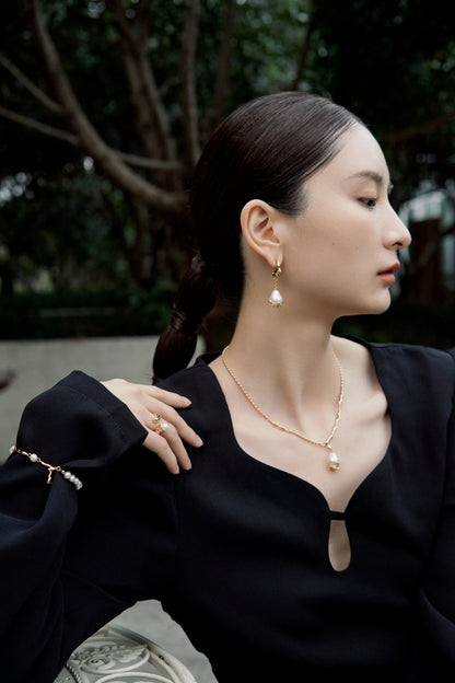 Fluid Sculptural Pearl Drop Earrings in Gold and Silver | BARØ